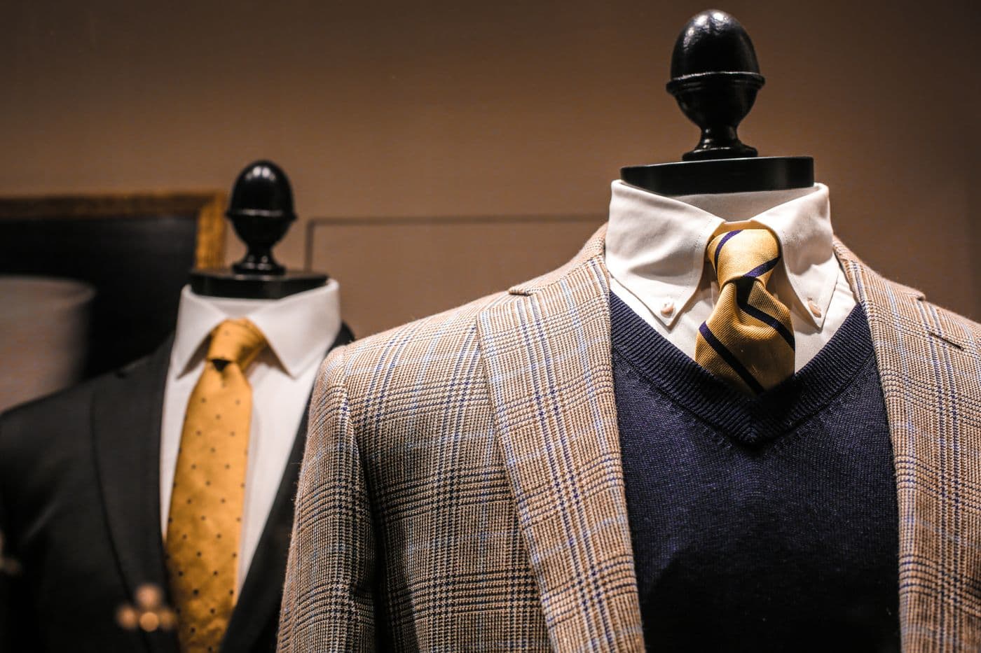 Tailored suits displayed on mannequins